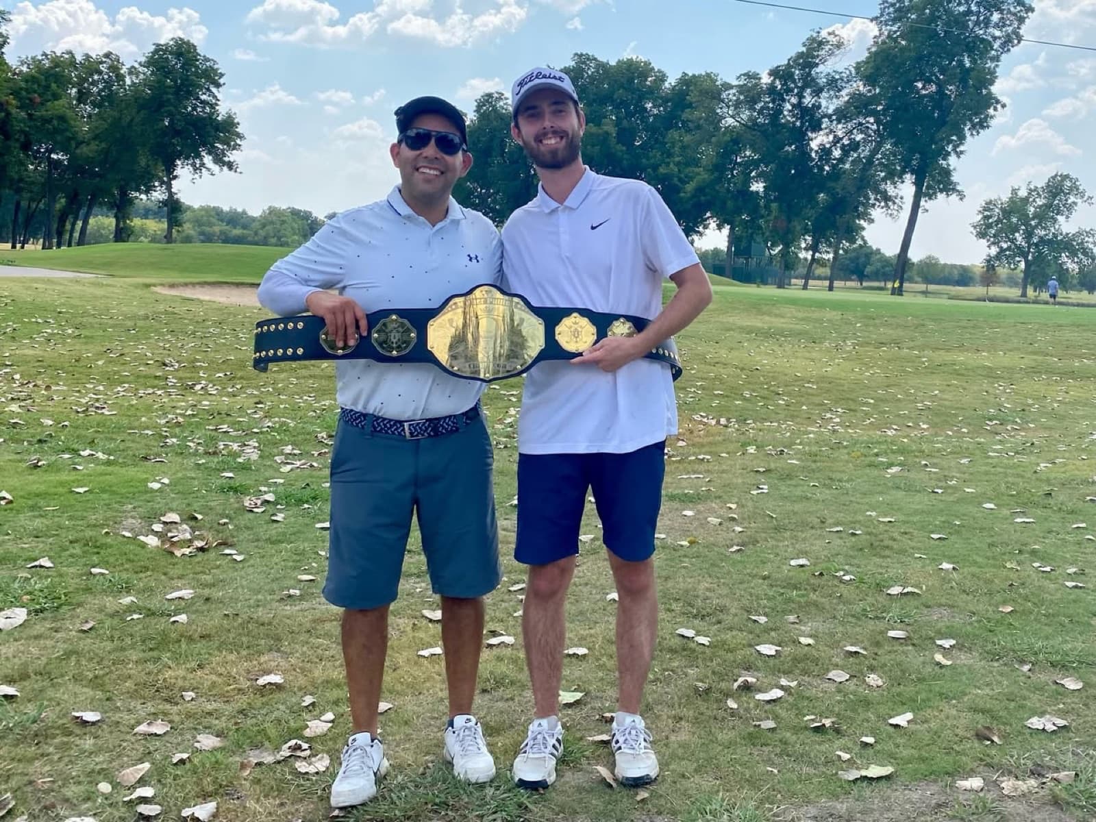 Mother Putting Champions holding the Double Bogey championship belt